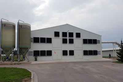 Poultry house and two silos